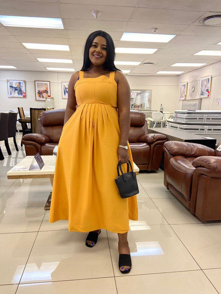 Yellow sleeveless high-waist pleated midi dress with square neckline and full hem