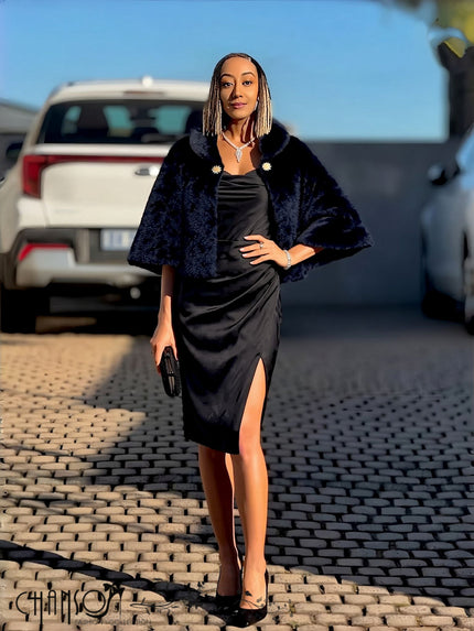 Black faux fur cropped cape jacket with decorative brooches, open front, batwing sleeves