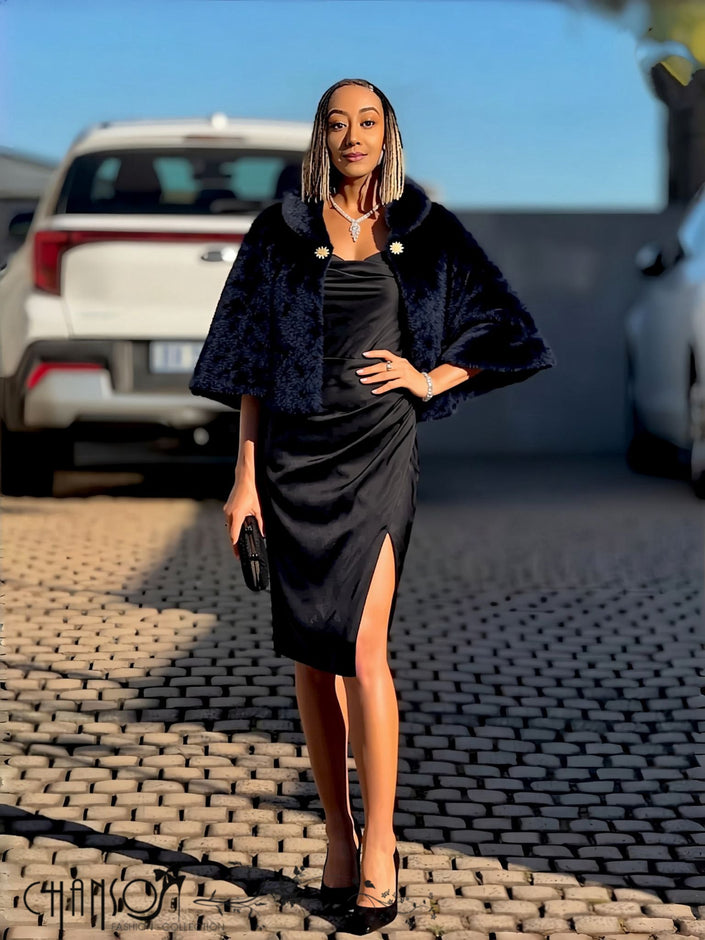Black faux fur cropped cape jacket with decorative brooches, open front, batwing sleeves