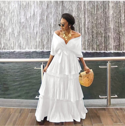 White off-shoulder tiered maxi dress with draped V neckline and ruffle skirt