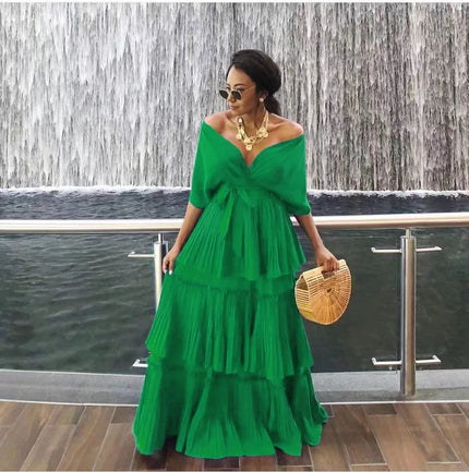 Green off-shoulder tiered maxi dress with draped V neckline and ruffle skirt