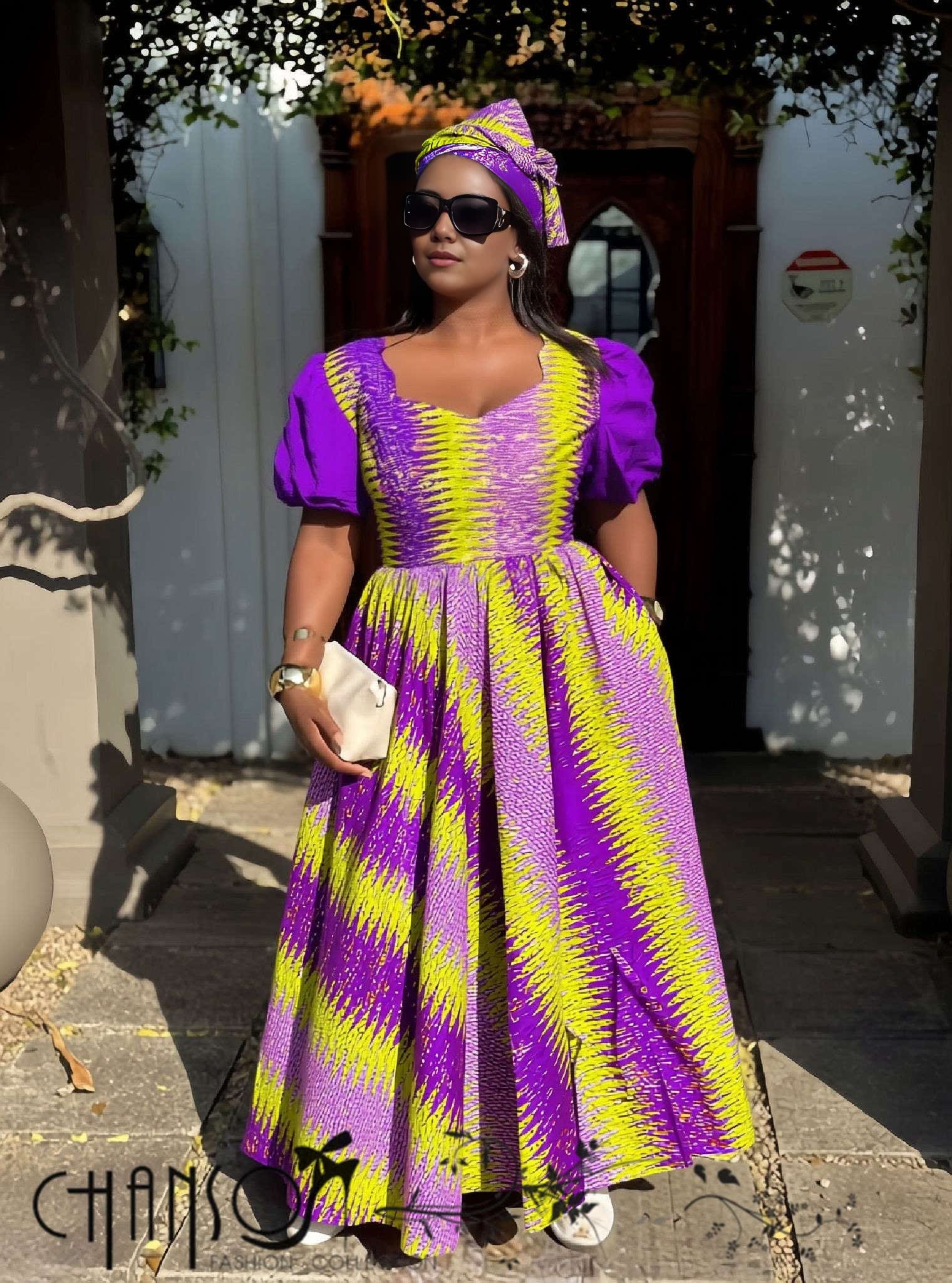 Purple maxi dress with puff sleeves and geometric stripe print, fitted bodice