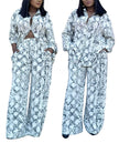 Snake print twin set: knotted button blouse and wide-leg pants, light blue/dark pattern