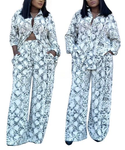Snake print twin set: knotted button blouse and wide-leg pants, light blue/dark pattern