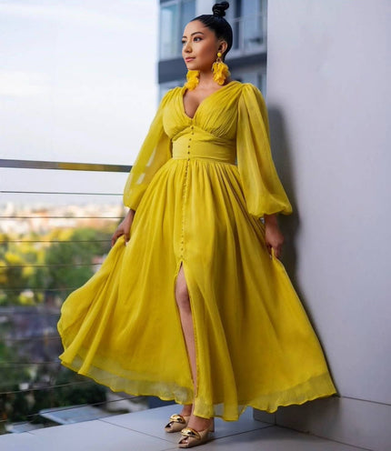 Yellow puff-sleeve evening maxi dress with V-neck, button front, and side slit