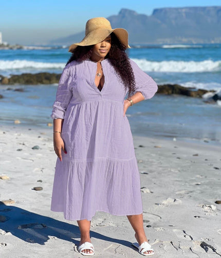 Light purple tiered maxi dress with V-neck and three-quarter sleeves, keyhole front