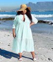 Light mint tiered maxi dress with V-neck and three-quarter sleeves, keyhole front