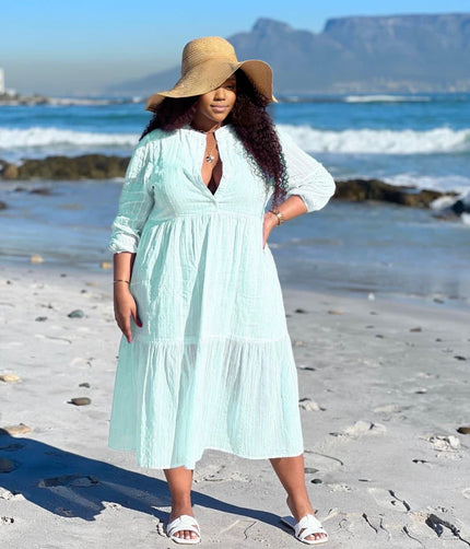 Light mint tiered maxi dress with V-neck and three-quarter sleeves, keyhole front