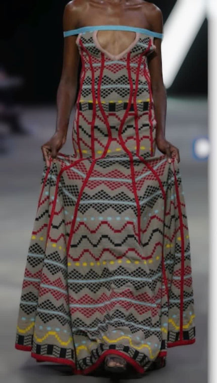 Geometric print maxi dress with off-shoulder look, red, black, and white.