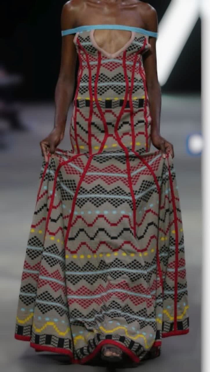 Geometric print maxi dress with off-shoulder look, red, black, and white.