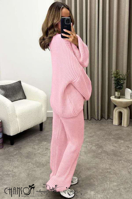 Pink knit twin set with V-neck button cardigan and matching wide-leg pants