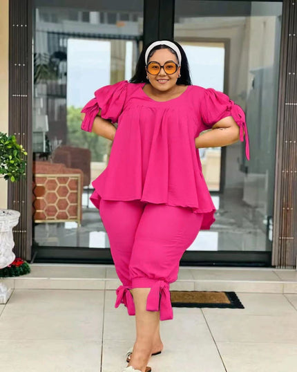 Deep pink ruffle-sleeve twin set with peplum top and pull-on stretch waist pants