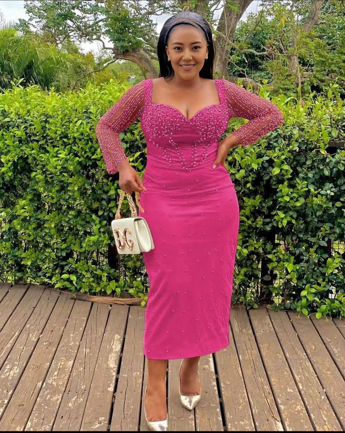 Hot-pink sequin sheath midi dress with sweetheart neckline and long sleeves