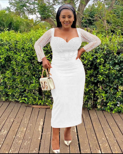 White sequin sheath midi dress with sweetheart neckline and long sleeves