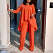 Orange-red asymmetrical blouse and wide-leg pants twin set