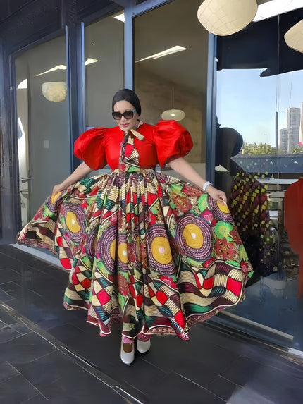 African print maxi dress with red puff sleeves and multicolor flared skirt