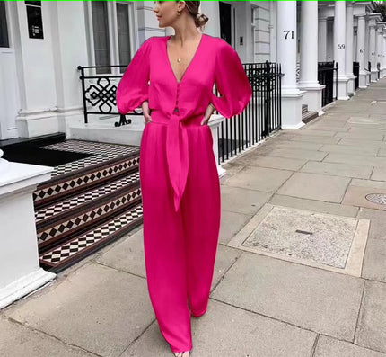 Deep pink V-neck puff-sleeve jumpsuit with adjustable waist tie and wide-leg pants