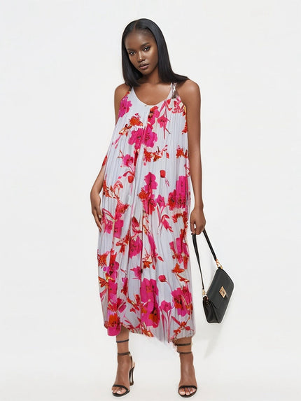 Pleated midi dress with white base and pink-red floral pattern, spaghetti straps