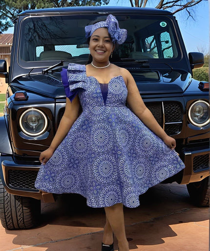 One-shoulder African print ruffle dress in blue with circular patterned flare skirt