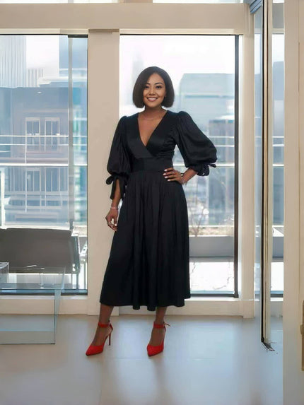 Black midi dress with puff sleeves and V-neck, gathered waist