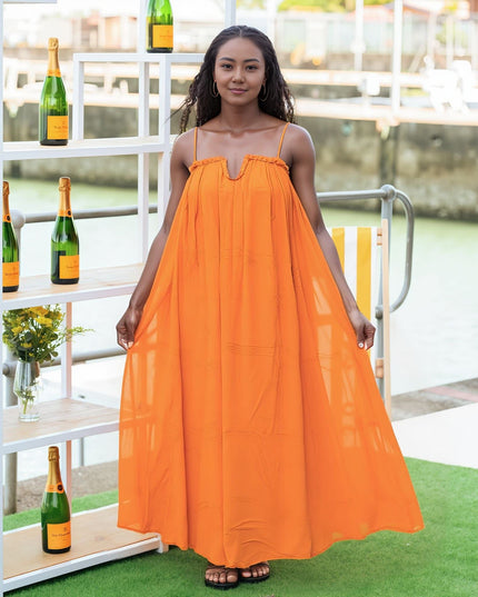 Flowy orange-red maxi dress with adjustable spaghetti straps and gathered square neckline