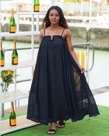 Flowy black maxi dress with adjustable spaghetti straps and gathered neckline
