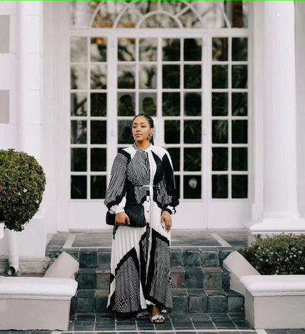 Geometric black-and-white maxi dress with button-front top and long flowing skirt