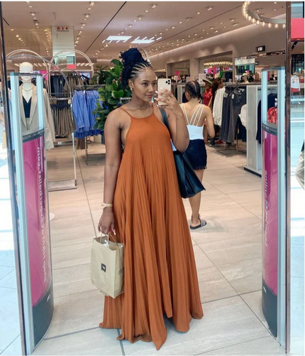 Burnt orange pleated spaghetti-strap maxi dress with scoop neckline, long skirt