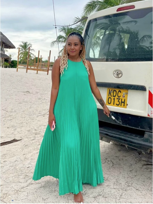 Turquoise pleated spaghetti-strap maxi dress with scoop neckline and gathered hem
