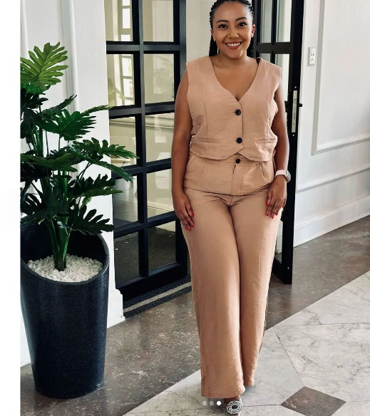 Sleeveless vest and trouser twin set in beige with button-front V-neck look.