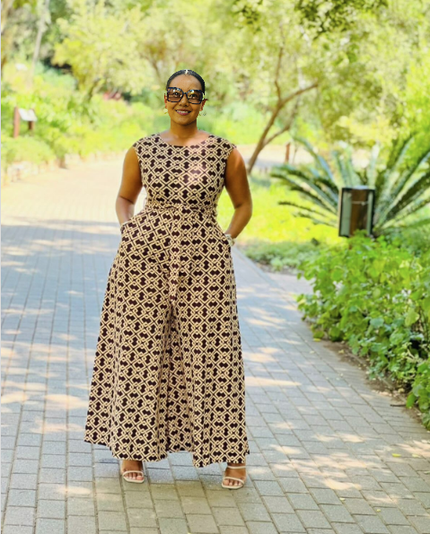 Sleeveless geometric wide-leg jumpsuit in black and cream lattice pattern