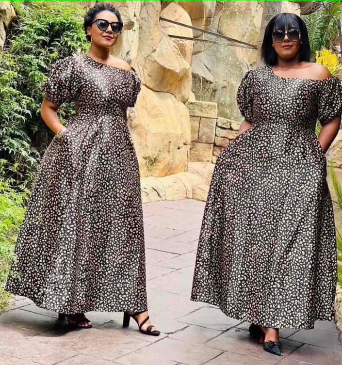 Floral midi dress with one-shoulder neckline, puff sleeves, gathered skirt, black-and-white.