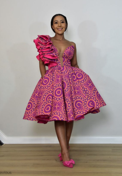 Purple one-shoulder midi dress with layered ruffle detail and circular African print