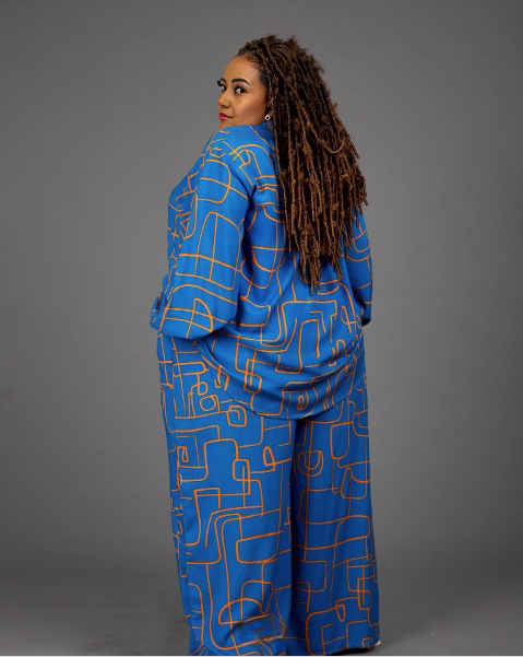 Geometric print shirt and pants set in blue, side view with button-front top and wide legs