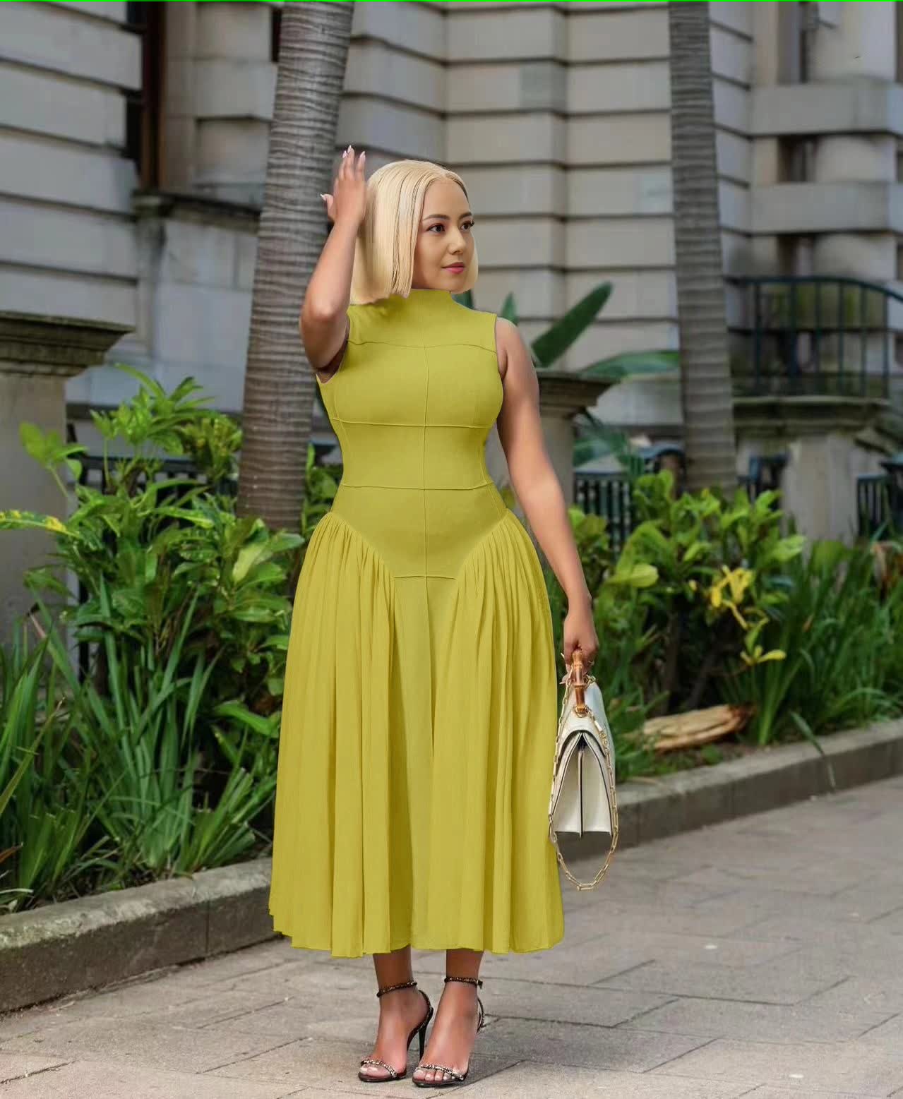Lime yellow pleated midi A-line dress, sleeveless high neckline, gathered flared skirt