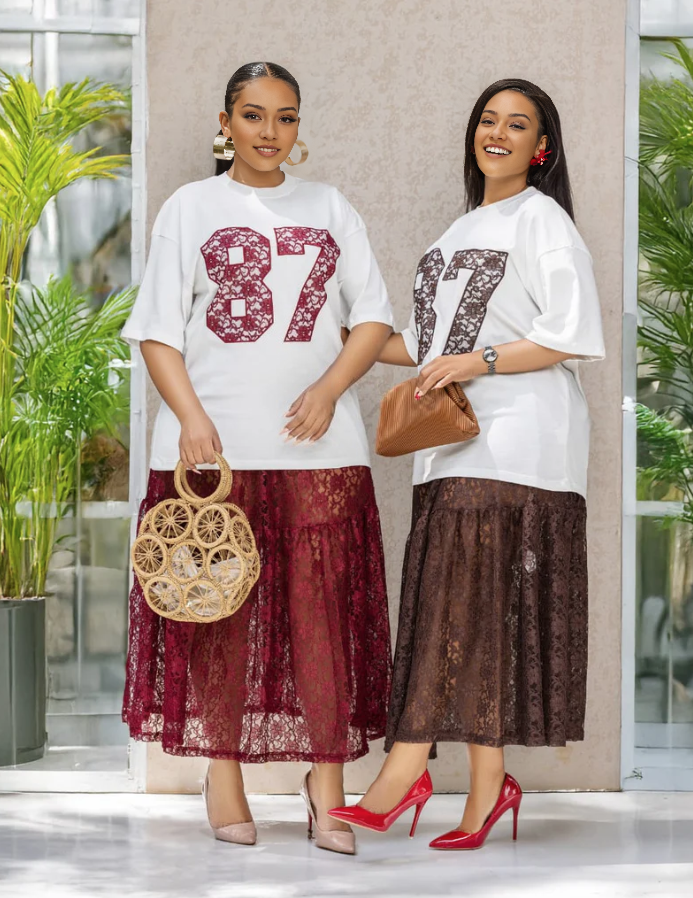Twin set: white sequin number T‑shirt with maroon lace midi skirt
