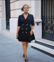 Navy double-breasted blazer dress with gold buttons, V-neck and flared mini skirt.