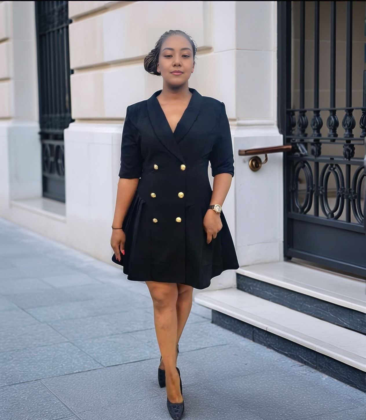 Navy double-breasted blazer dress with gold buttons, V-neck and flared mini skirt.