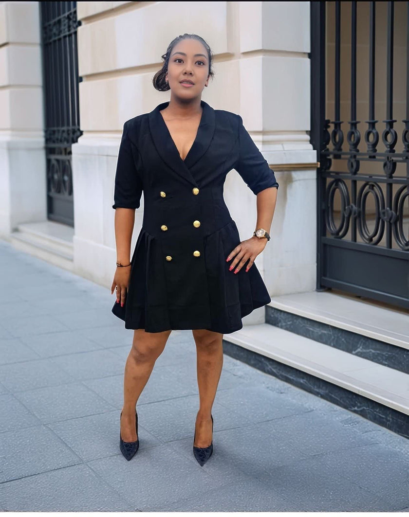 Navy double-breasted blazer dress with gold buttons, V-neck and pleated mini skirt.
