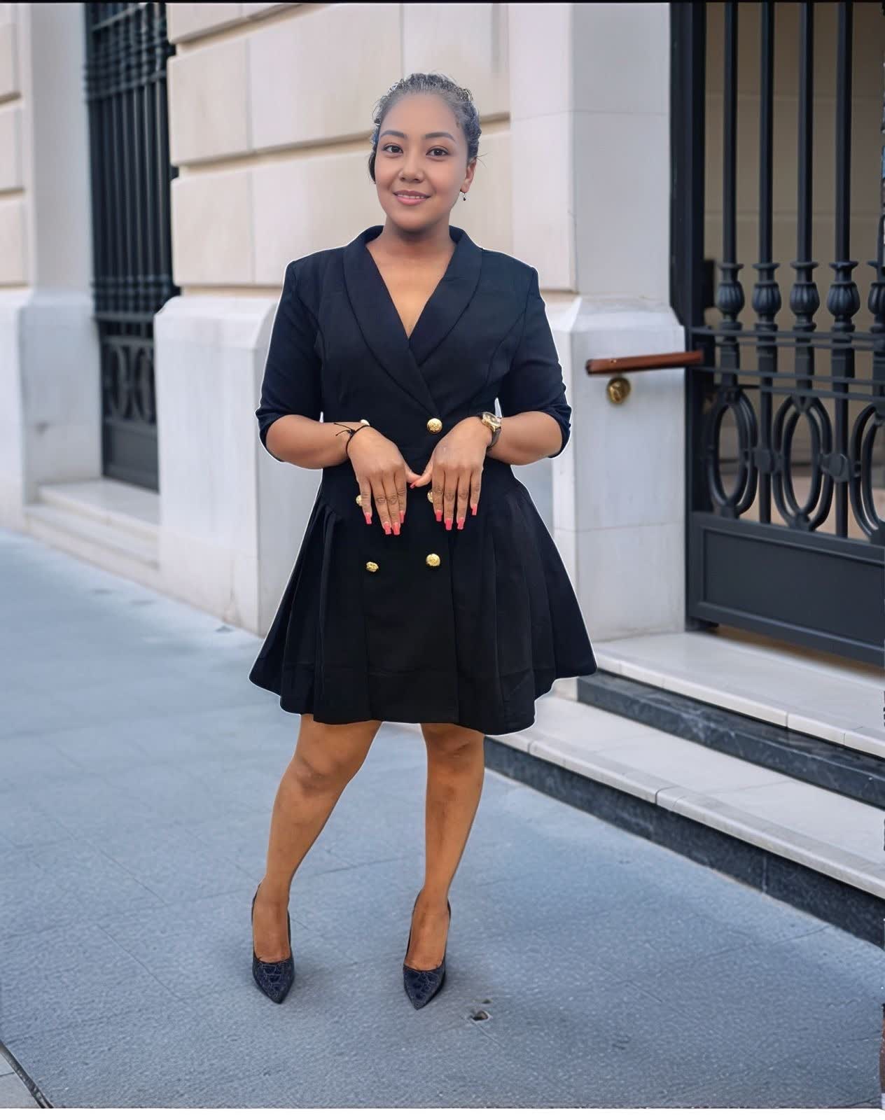 Black double-breasted blazer dress with gold buttons and V-neck, flared mini skirt.