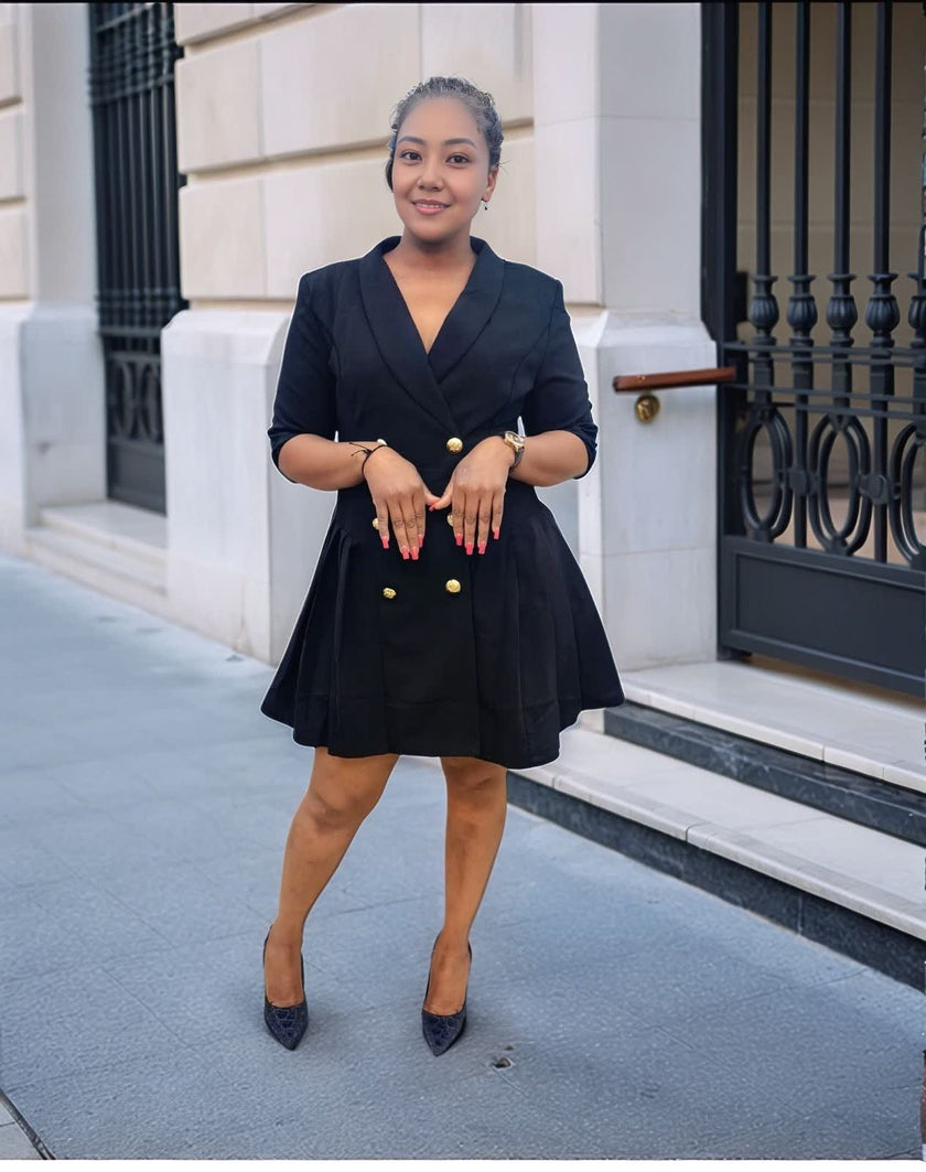 Black double-breasted blazer dress with gold buttons and V-neck, flared mini skirt.