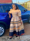 Striped heritage midi dress, beige bodice with puff sleeves and tiered navy/orange hem