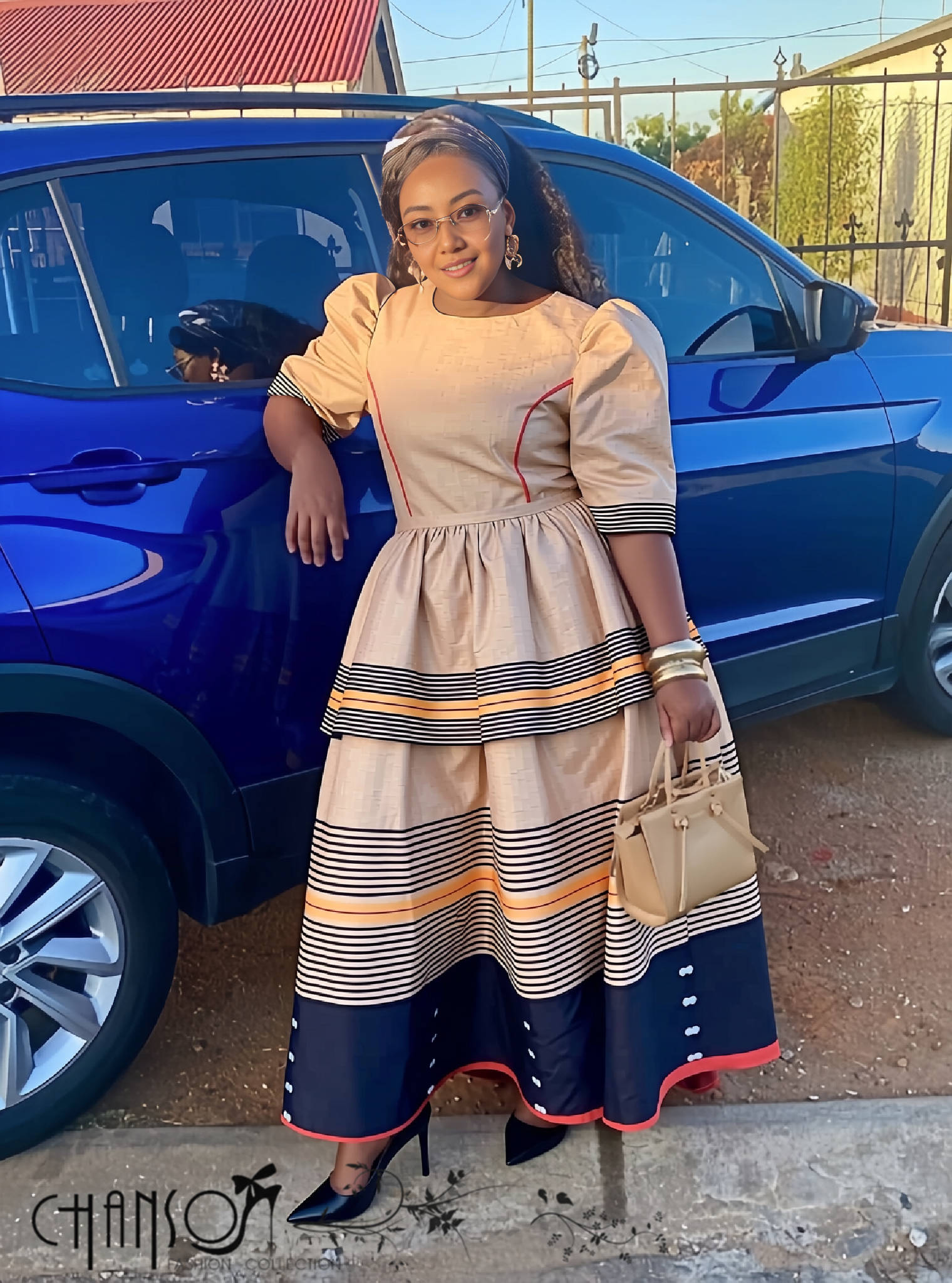 Striped heritage midi dress, beige bodice with puff sleeves and tiered navy/orange hem