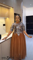 Printed bodice maxi dress with brown tulle skirt and fitted waist
