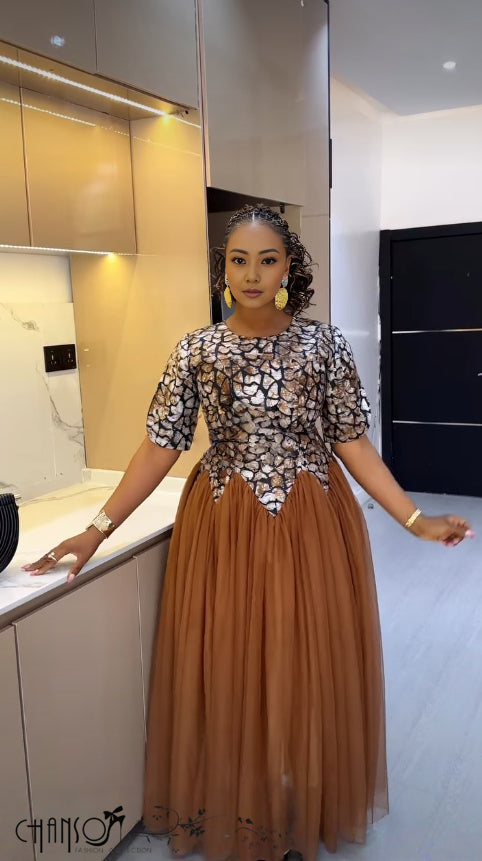 Printed bodice maxi dress with brown tulle skirt and fitted waist