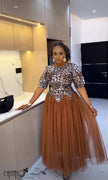 Printed bodice maxi dress with brown tulle skirt and short sleeves