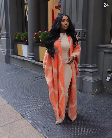 Orange-red oversized shawl coat with geometric knit pattern, open front
