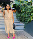 Wheat sleeveless vest and wide-leg trousers with buttoned V-neck detail
