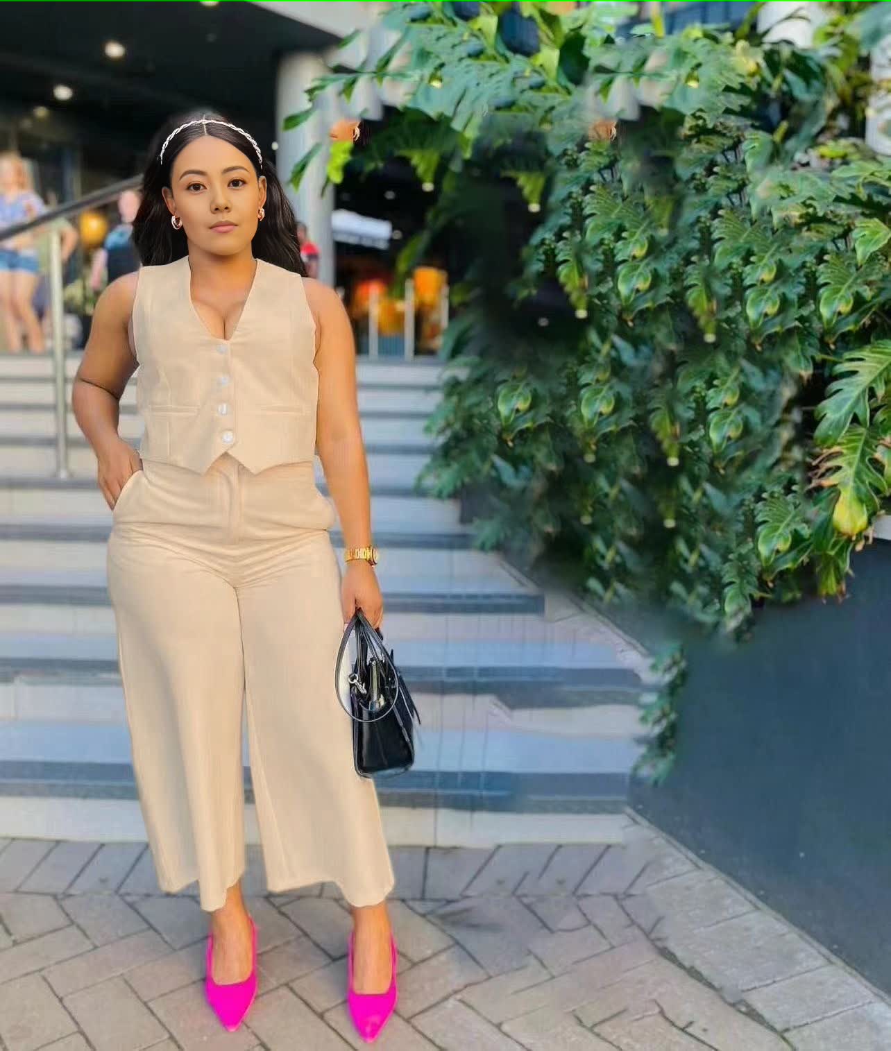 Wheat sleeveless vest and wide-leg trousers with buttoned V-neck detail