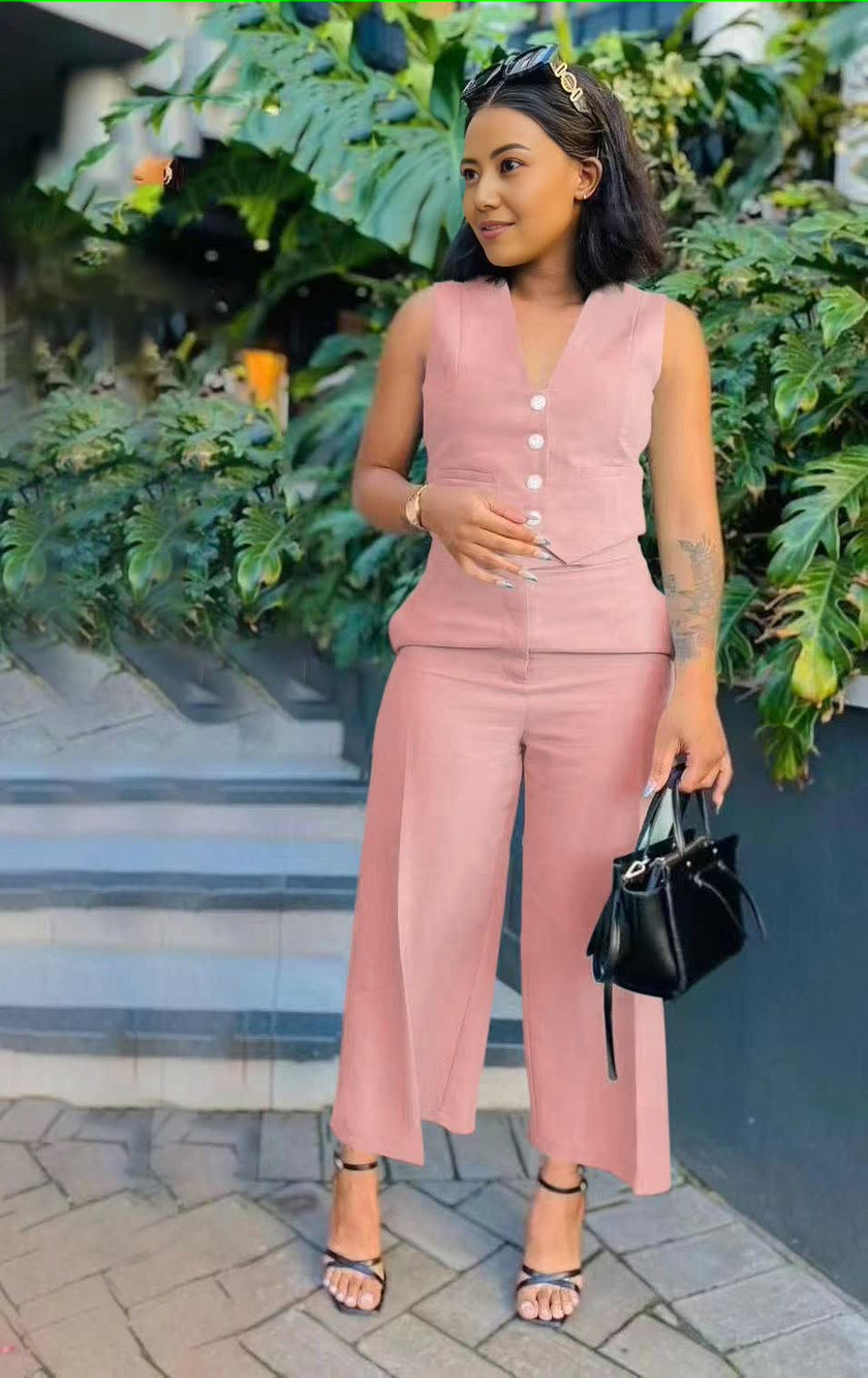 Pink sleeveless vest and wide-leg trousers with buttoned V-neck detail